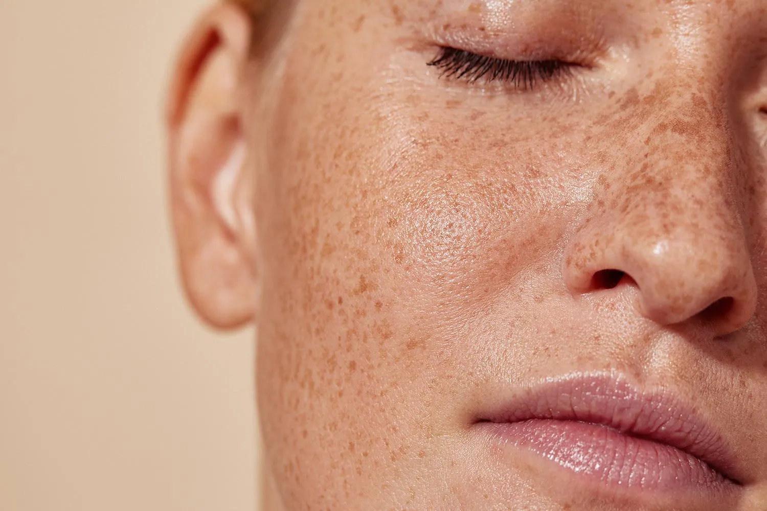 Close-up of a woman's hydrated, glowing facial skin